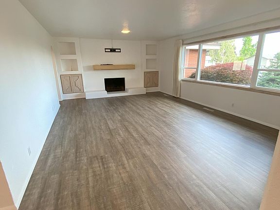 Living room - TV mount available for tenants; wood burning fireplace is not functional