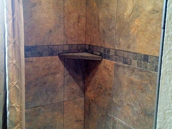 Tiled bathtub area hall bath