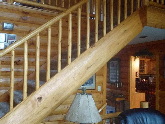 log stair case off living