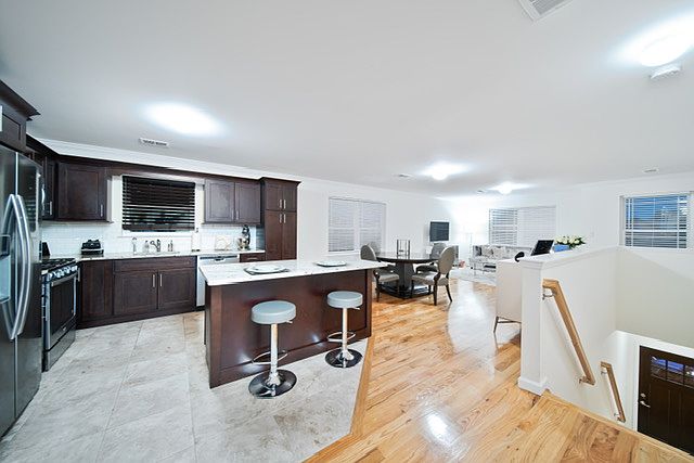 Open Kitchen with dishwasher, microwave, and double door refrigerator.