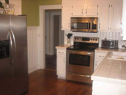 Beautifully updated kitchen with stainless steel appliances and hardwoods