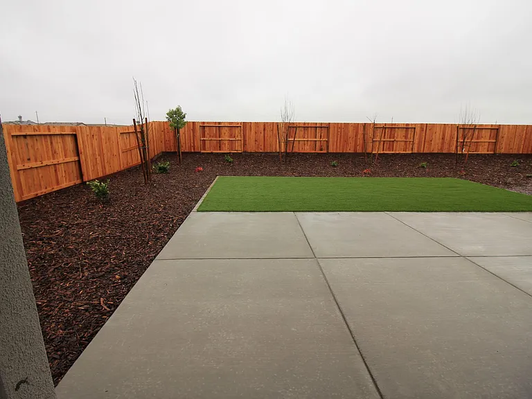 Yes, it's a rather large backyard . That's artificial turf, so NO mowing.
