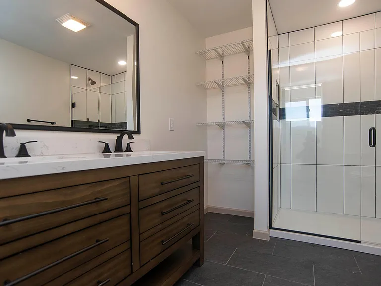 Huge two-sink ensuite bathroom with storage