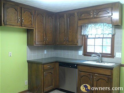 Kitchen has granite tops, backsplash, stainless-steel appliances