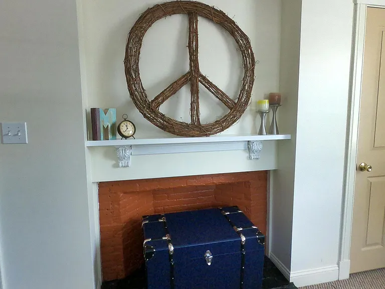 Decorative fireplace in bedroom (shown prior to recent repainting).