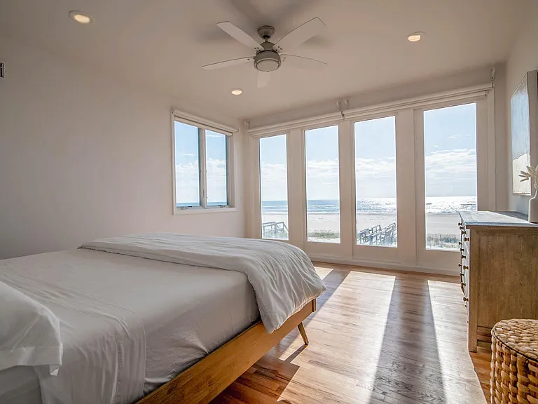 Oceanfront gorgeous master bedroom suite with remote shades for privacy. So blissful, you may never want to leave the bedroom! This master has an en-suite master bathroom.