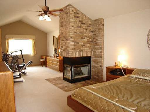 33 ft. Master W/3 sided fireplace, walk-in closet w/ access to 2nd. fl. laundr