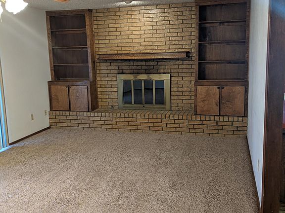 Living room fire place and book selves