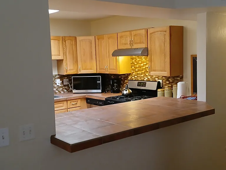 A veiw of the kitchen from the living room.