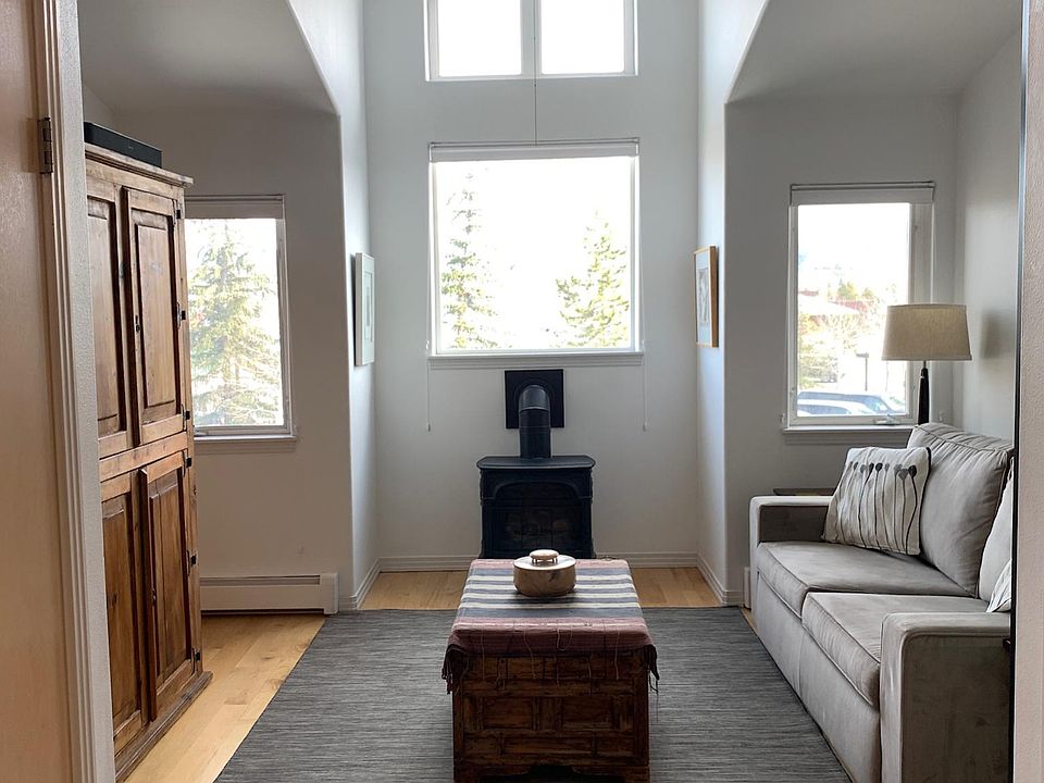 Bright and sunny living room with views of Grays & Torrys.
