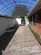 Shaded Walkway at Rear of Home to Patio