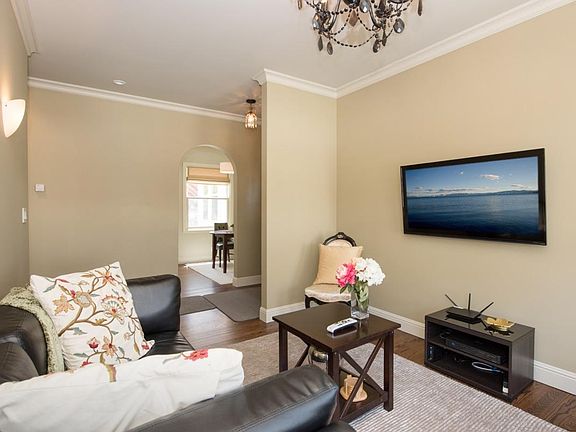 Hardwood floors and crown moldings throughout home.
