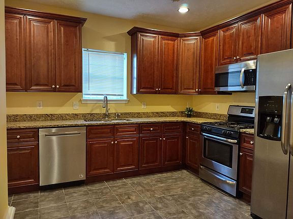 Kitchen with steel appaliances and Granite counter.