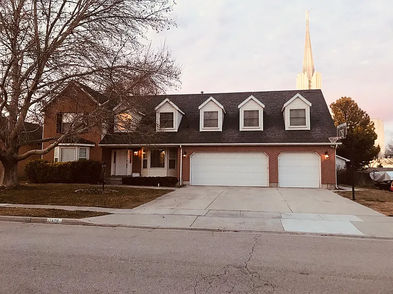 Fall view: Exterior of home. Your Garage spot is the door on the right and the driveway in front of it would also be for your use.
