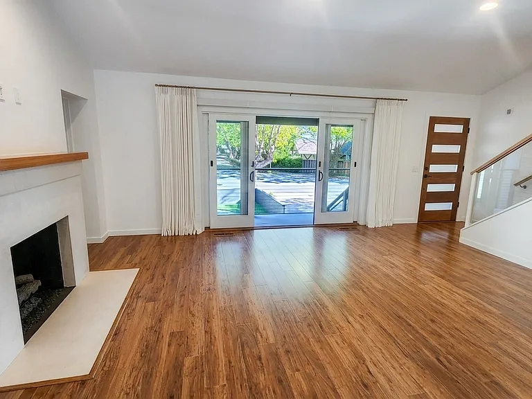 Living Room south-facing / street-facing doors open to front porch and yard