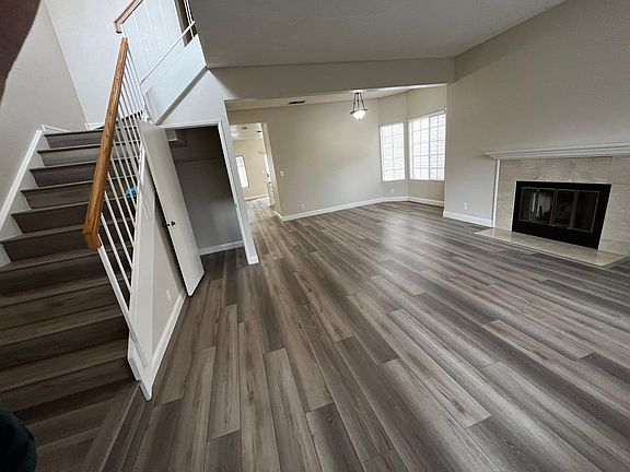 living room with fireplace and dining room