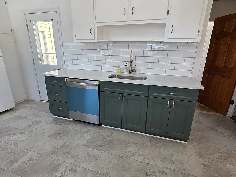 New cabinets, countertop, sink, garbage disposal, dishwasher