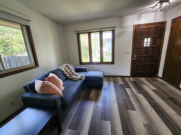 Showing both sets of windows in living room.