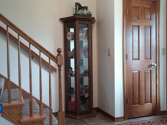 Foyer w/partially open stairs.