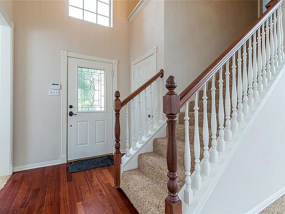 Entry has wood floors, AND an entry door to garage...