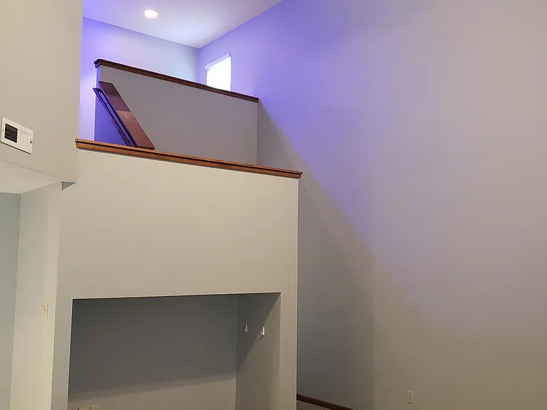 Living room view, looking at entertainment nook and upstairs loft area