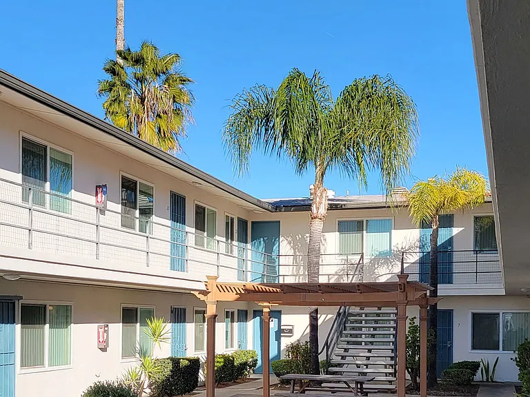 Beautiful palm trees enhance the views at Orlando Woods Apartments in El Cajon, California.