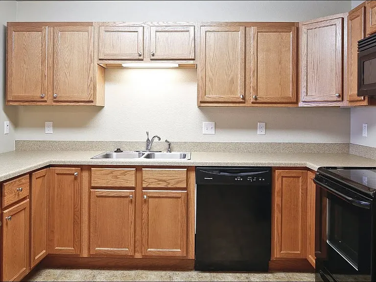 Elevate your living at Northdale Apartments with our modern kitchen featuring sleek appliances and ample storage space. Perfect for culinary enthusiasts and family gatherings. Schedule your tour today and envision your new home!
