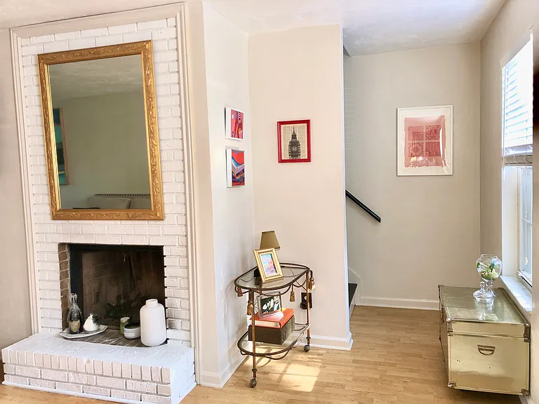 Fireplace And Staircase to Second Floor