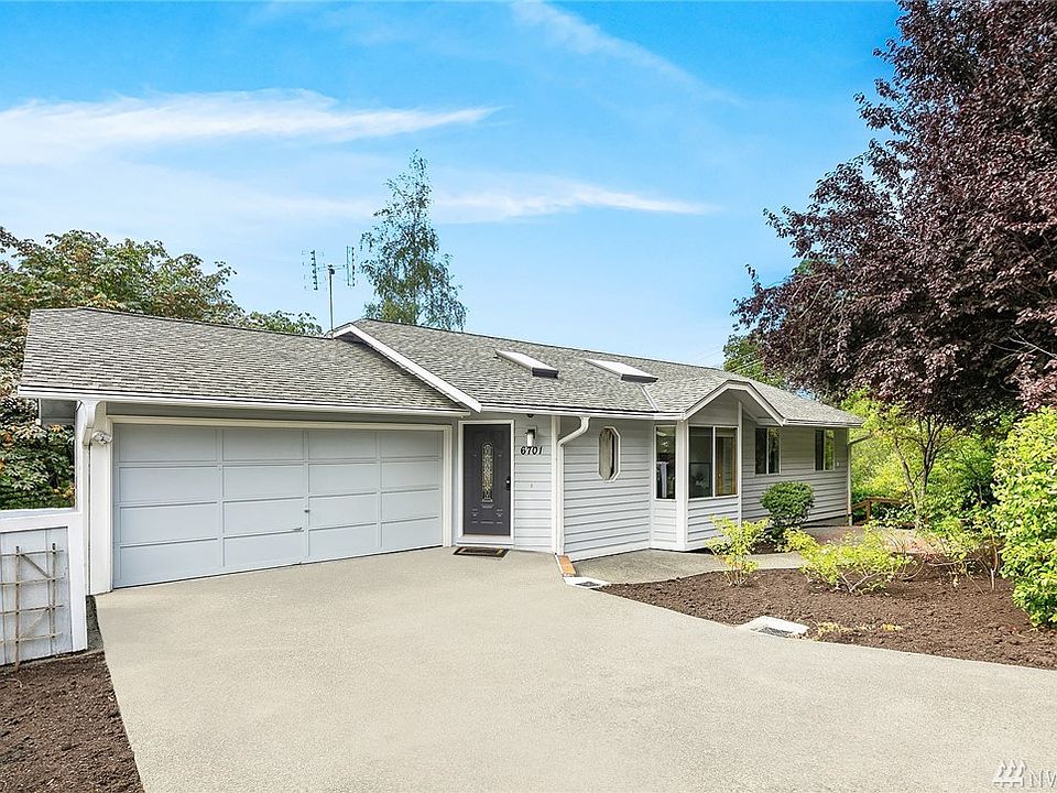 Front of home with two car garage and plenty of off street parking