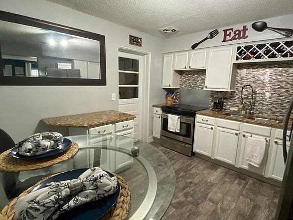 kitchen with washer and dryer in separate room
