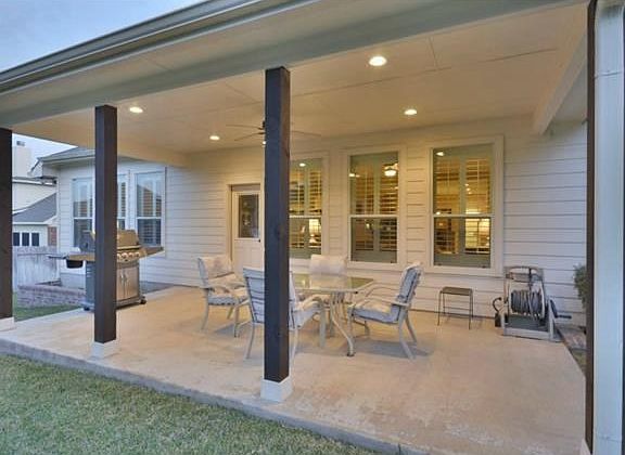 covered back porch with can lights and ceiling fans