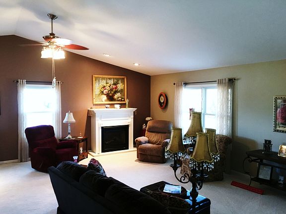The living room has a nice open concept also featuring a gas log fireplace.