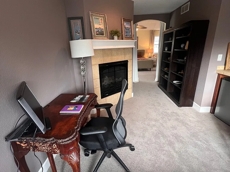 Retreat (we call it "The Snug") off main bedroom. Antique desk, fireplace, wetbar, bookcases, chaise.