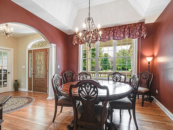 Large formal dining room with beautiful hardwood floors and gorgeous view.