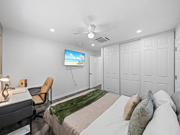 Rest and work in one place_this bedroom includes a quiet workspace with a desk and chair.