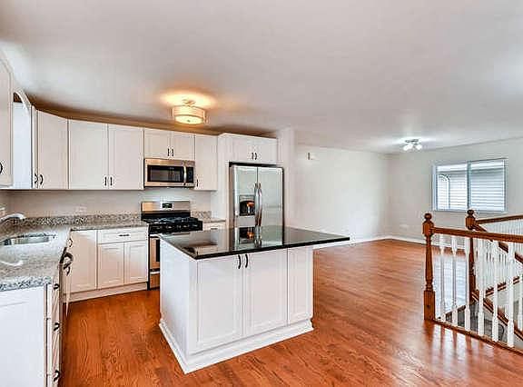Completely Remodeled Kitchen with Granite Counters and New Hardwood Floors