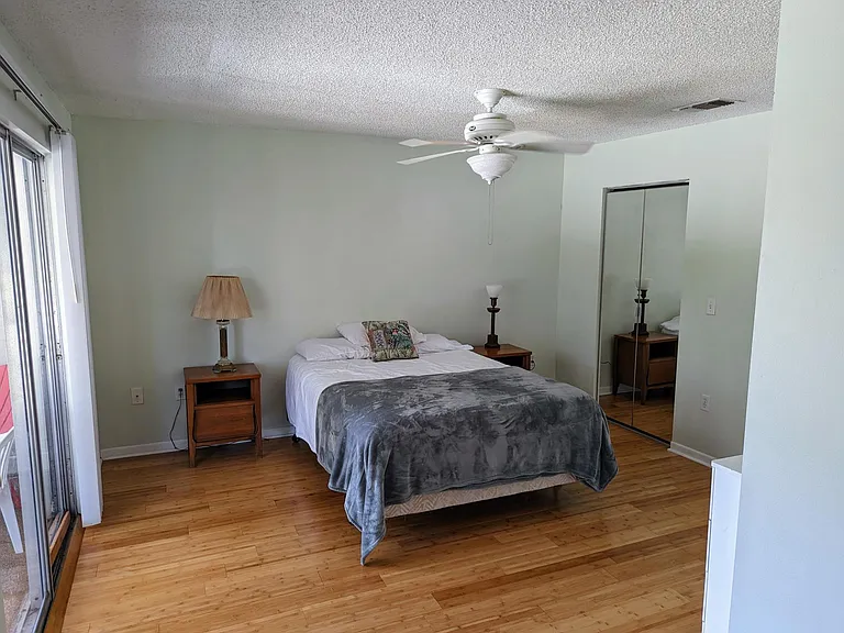 Second floor front bedroom with screened balcony to the left