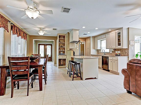 View of the breakfast room, kitchen, family room to the right, and entry way. This is a great space for entertaining!