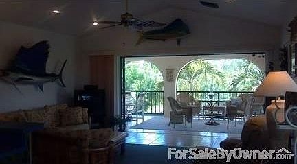 View from Kitchen
						:
						Open air living room with triple sliding disappearing wall doors. Tropical furn!