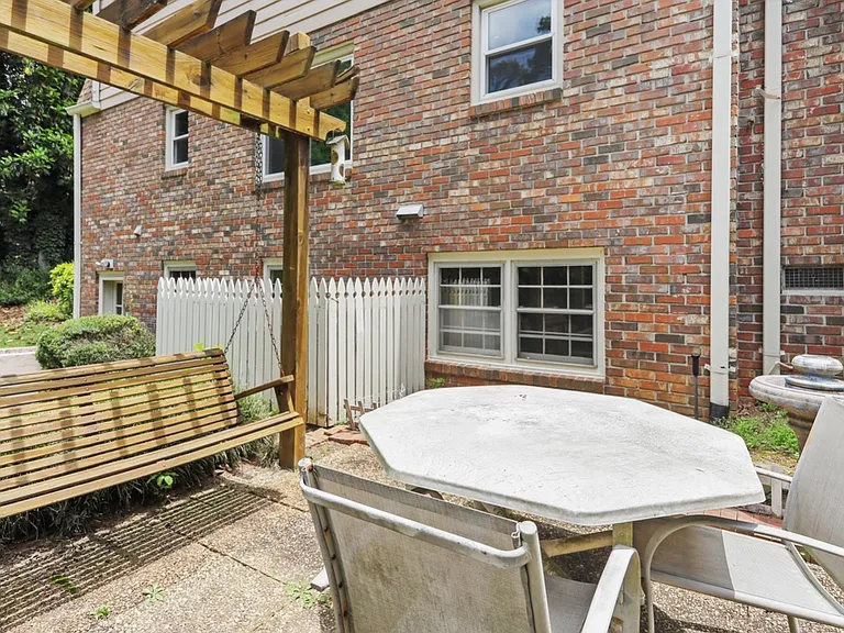 The backyard patio access from sunroom, backyard and basement.