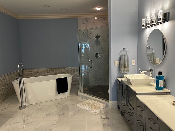 Master bathroom with stand alone bathtub.