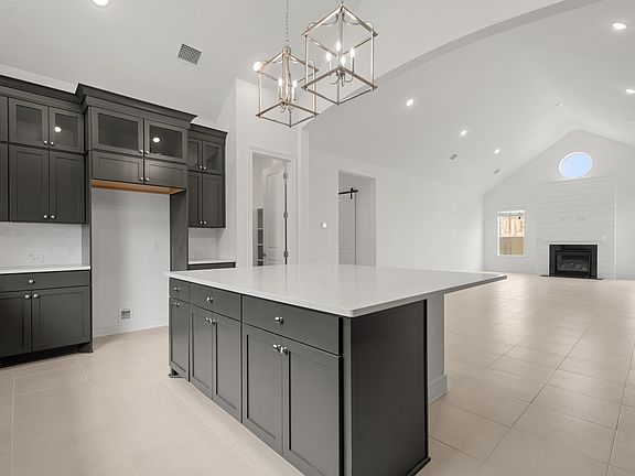 Kitchen with upper glass cabinets