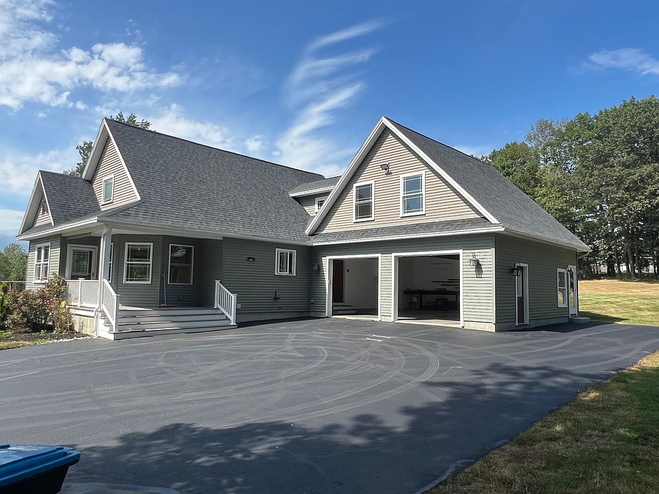 House, showing entry and parking to apartment on right side of garage.