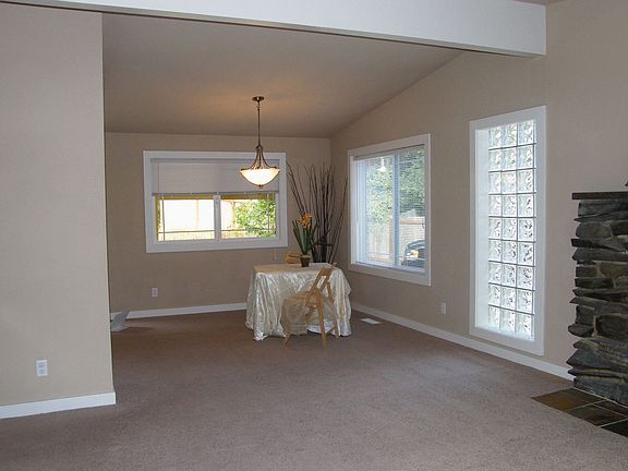 Dining room end of great room, right off kitchen. Living rm has stone fireplac