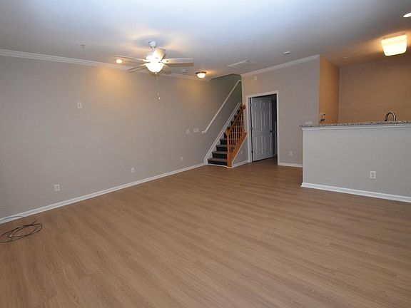 Great Room From Half Bath Looking Towards Staircase
