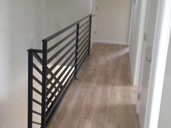 second floor hallway with threelarge skylights