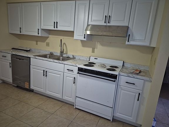 All new Kitchen Cabinets, dishwasher, sink and faucet, vent hood and countertop