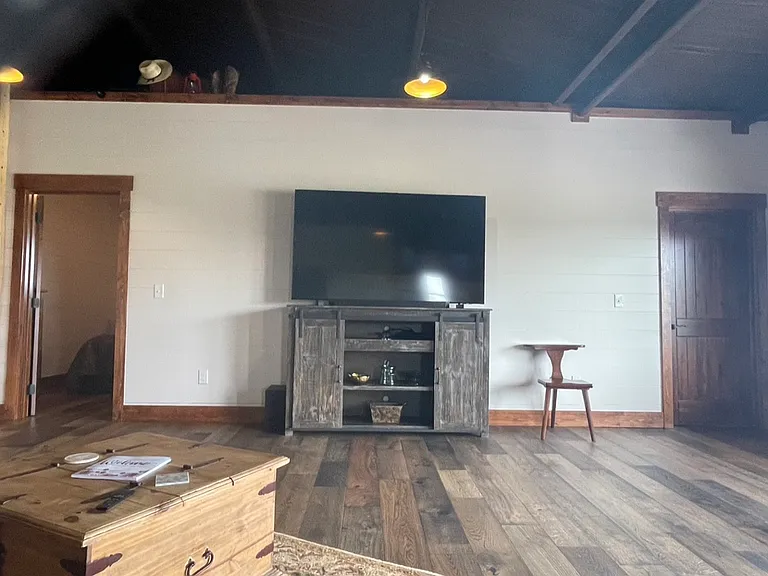 Living room with 75" TV.