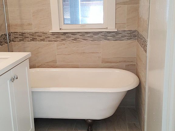 master bath with original claw foot tub