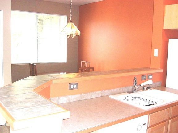 Kitchen overlooking dining room area.